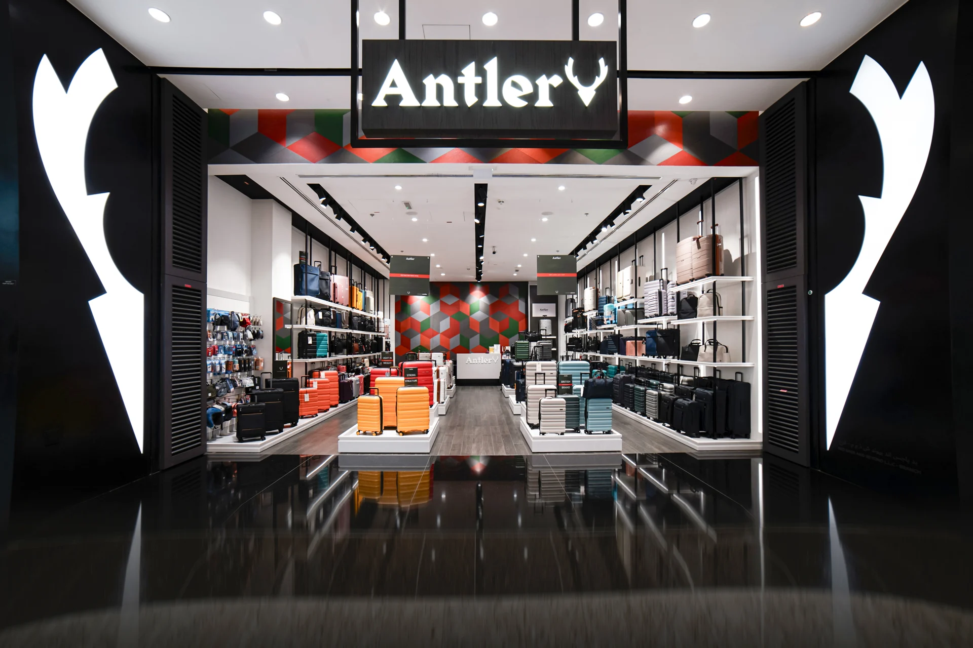 Wide Antler store entrance with luggage displays.