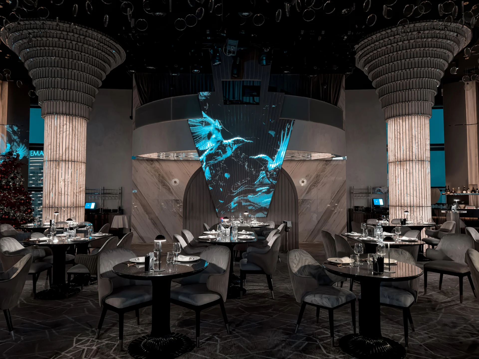 BIRDS Dubai dining room with digital entertainment wall.