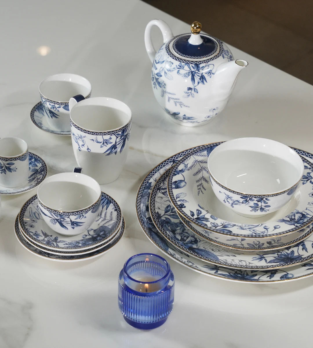 Luhpar Blue Jungle tea set arranged on a table.