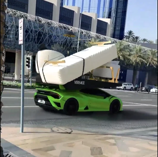 Lamborghini carrying a sofa near Dubai Mall.