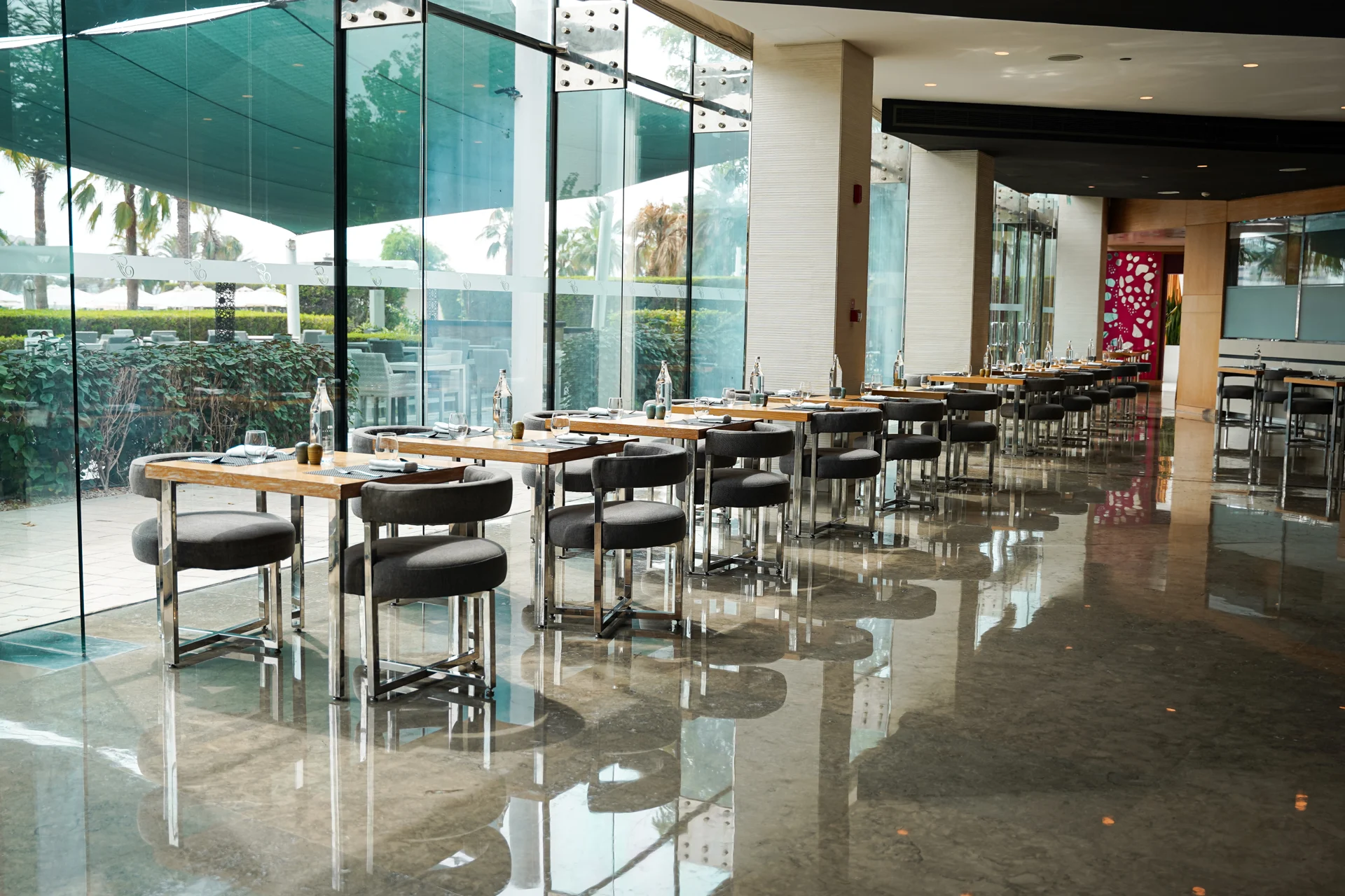 Glass-fronted dining space at Fairmont Bab Al Bahr.