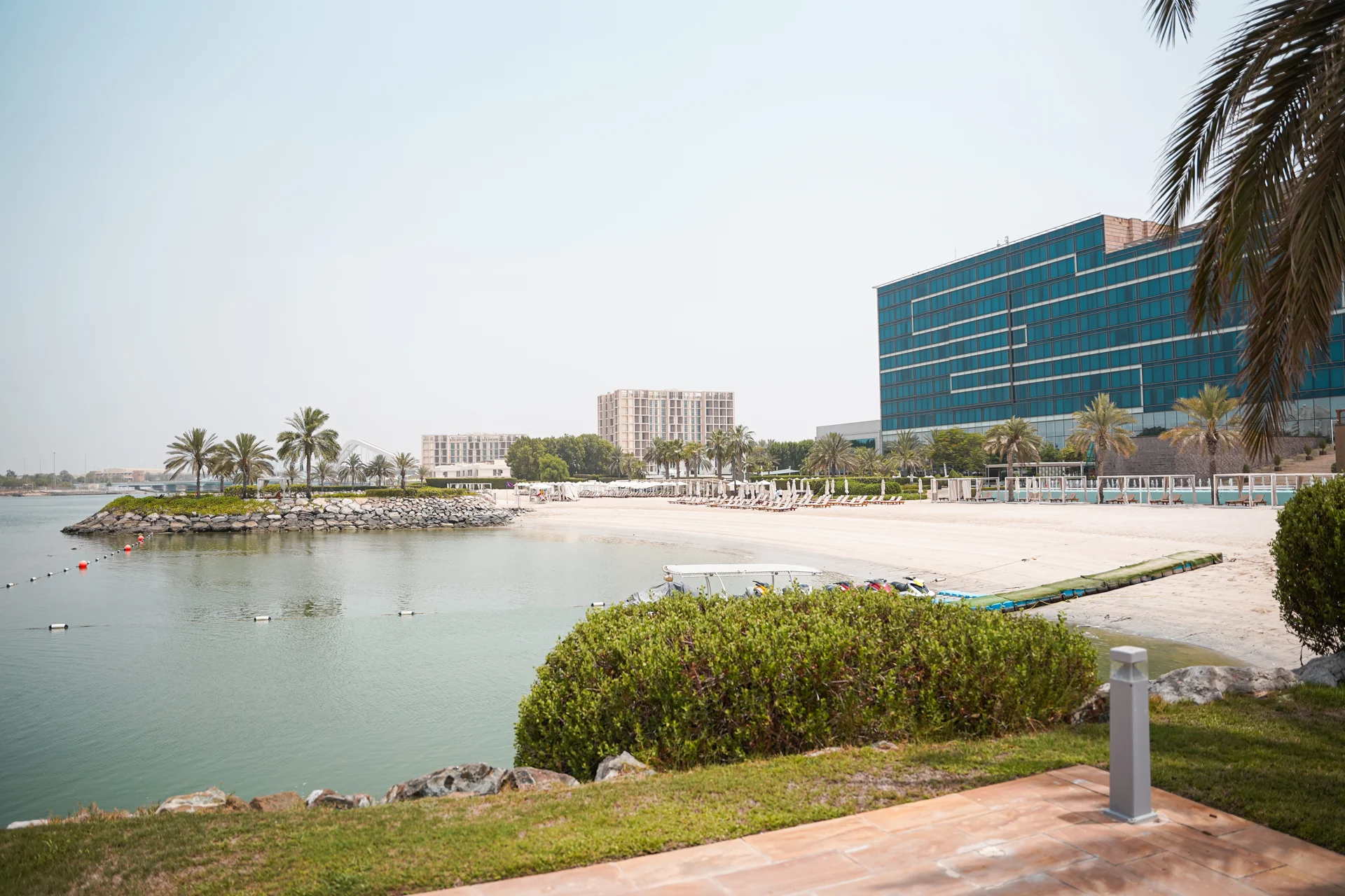 Fairmont Bab Al Bahr waterfront hotel and beach area.