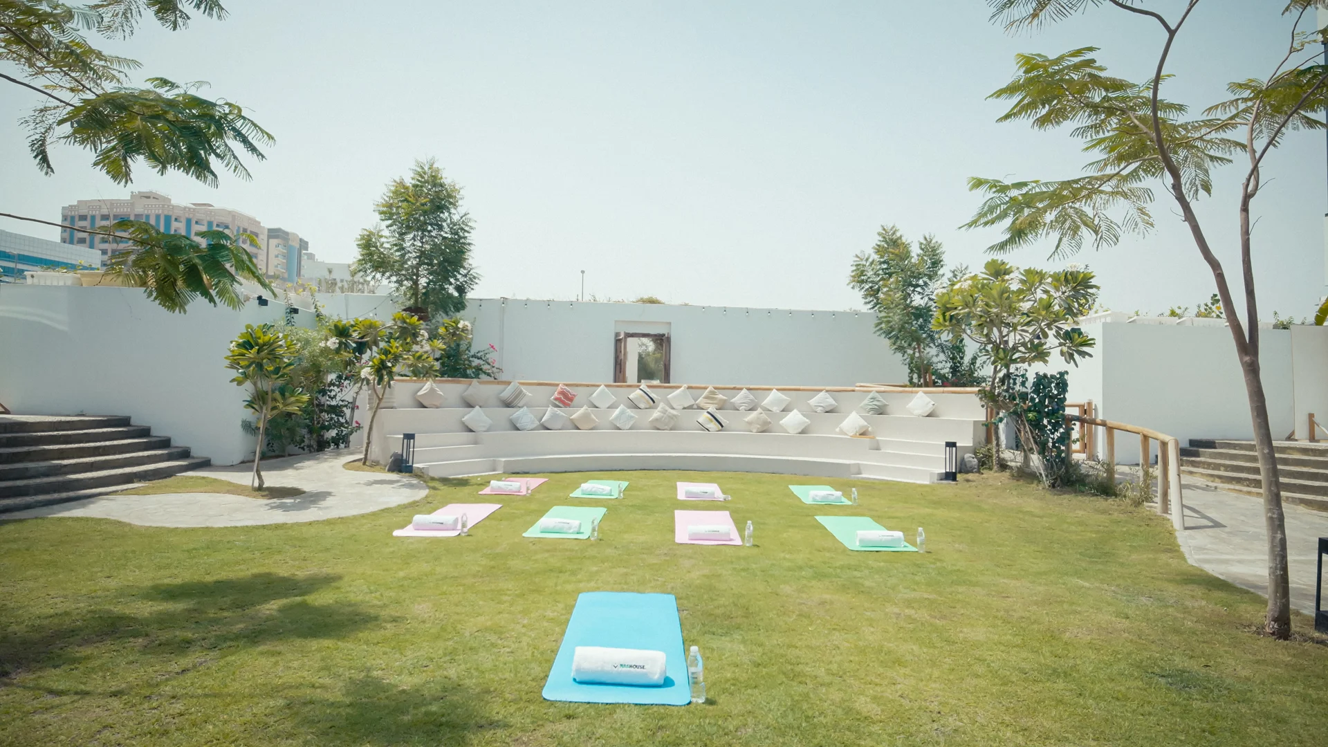 NAS House outdoor lawn prepared with yoga mats.