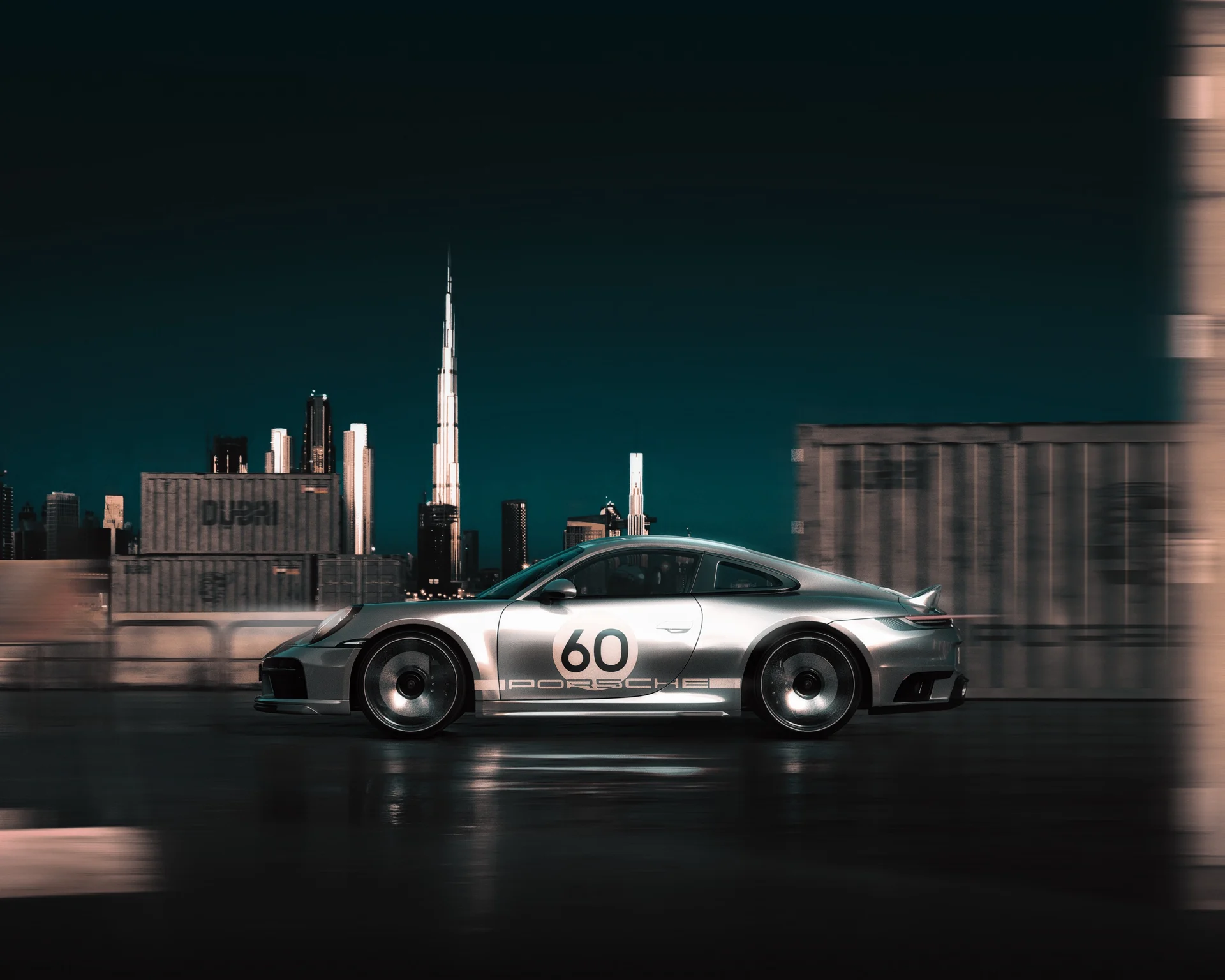 Porsche 911 photographed in motion against the Dubai skyline